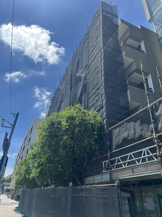 Scaffold installed along an urban building facade